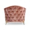 Modern blush armchair with accent cushion and sculptural design
