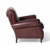 Classic leather club chair with tufted back and turned legs