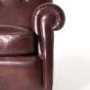 Heritage-style armchair with rolled arms and deep cushioned seat