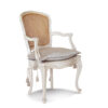 Handcrafted cane back chair with carved wood details