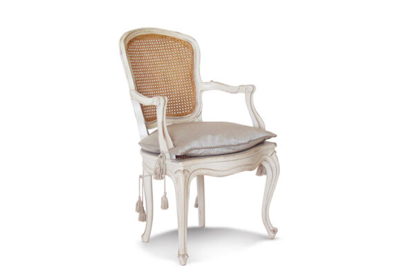 Handcrafted cane back chair with carved wood details