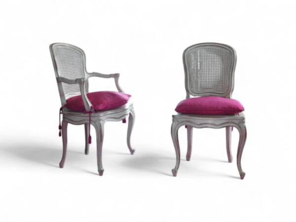 Vintage carved wood chair with cushioned seating and scroll arms