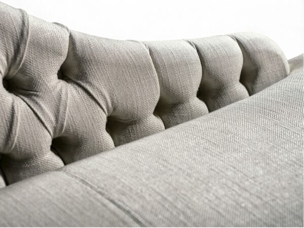 Elegant chaise lounge with gold base and cushioned seat