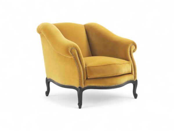 Mustard velvet armchair with dark carved wooden legs