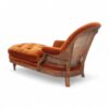 Vintage-inspired Opulent Orange Chaise Lounge in a sophisticated living room