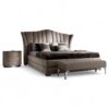 Luxury velvet bed with curved headboard