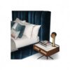 Elegant blue velvet bed with high-back tufted design for modern bedrooms.