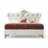 Onyx Grandeur Bed with tufted upholstery and intricate detailing