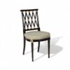 Empire-style wooden armchair with gold detailing and fluted legs