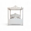 Elegant ivory canopy bed with hand-finished crown and posts