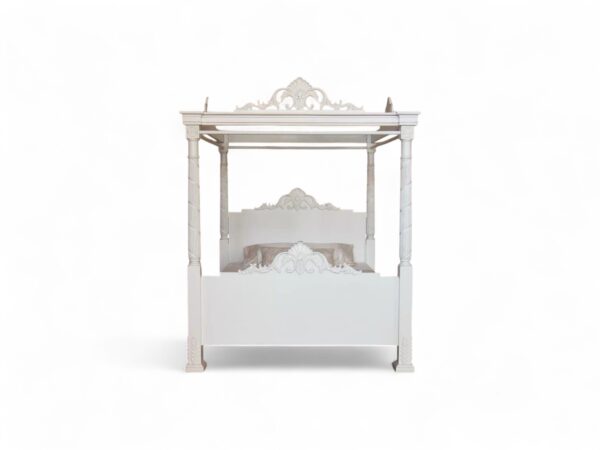 Elegant ivory canopy bed with hand-finished crown and posts