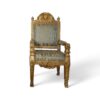 Antique gold armchair with patterned upholstery