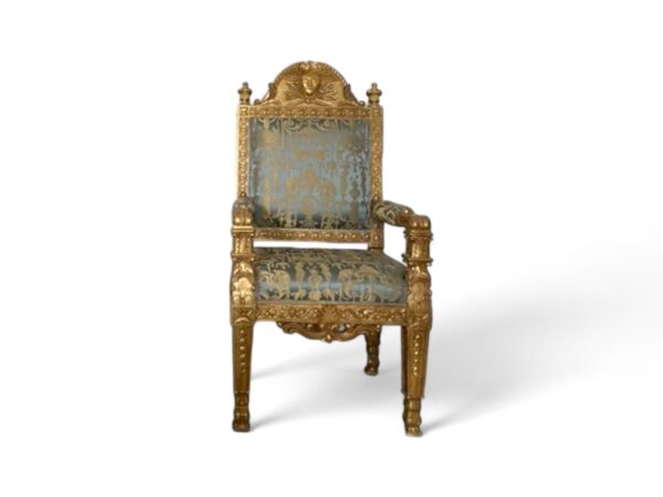 Antique gold armchair with patterned upholstery