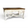 Ornate white wooden console with natural wood top