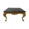 Elegant coffee table with detailed gold craftsmanship