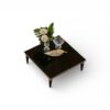 Designer table with tapered legs and gold tips