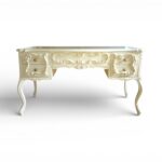 Ornate wooden writing desk with drawers