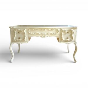 Ornate wooden writing desk with drawers