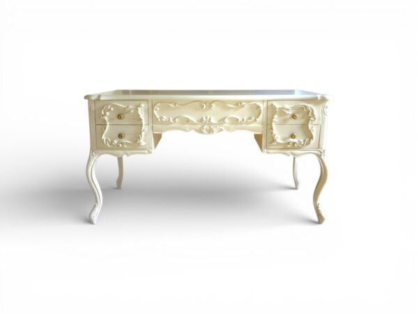 Ornate wooden writing desk with drawers