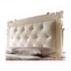 Elegant master bedroom bed with carved detailing