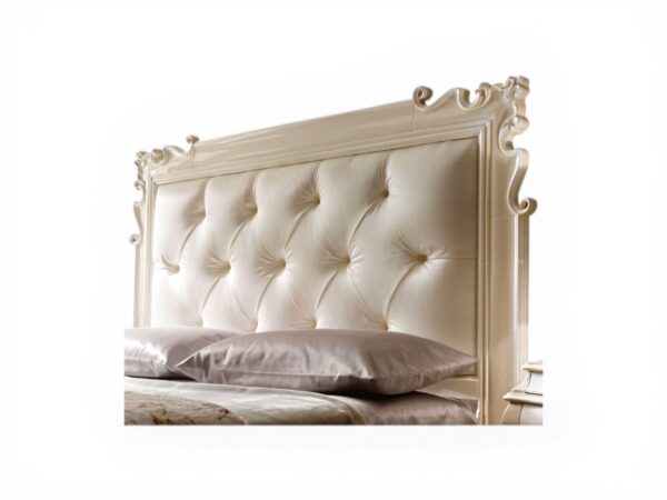Elegant master bedroom bed with carved detailing