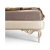 Classical luxury bed with curved legs and upholstery