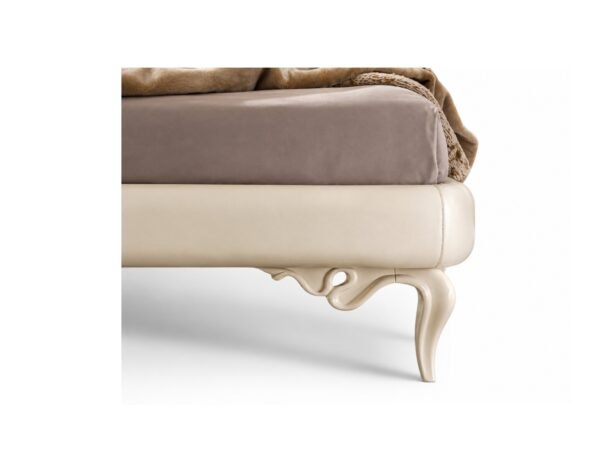 Classical luxury bed with curved legs and upholstery
