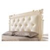 Elegant master bedroom bed with carved detailing