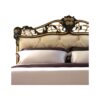 Luxury tufted bed with intricate gold detailing