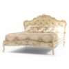 Coastal luxury bed with carved wooden detailing