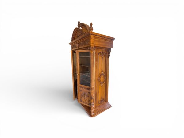 Tall architectural cabinet with ornate crown design