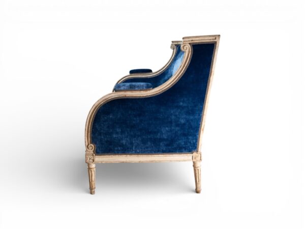 Classic velvet loveseat with elegant gold accents