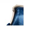 Elegant blue velvet loveseat with curved sides