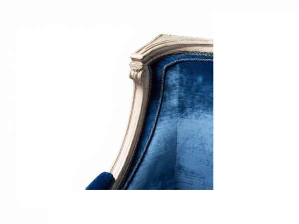 Elegant blue velvet loveseat with curved sides
