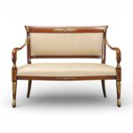 Empire style wooden settee with gold accents