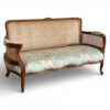 Luxury wicker sofa with polished wooden frame