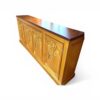 Wooden sideboard with intricate carved panels