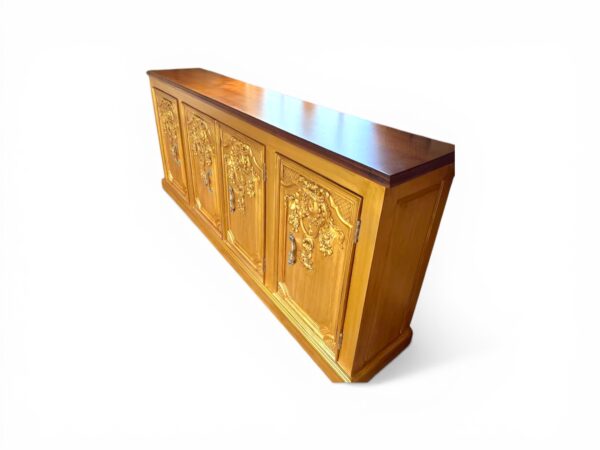 Wooden sideboard with intricate carved panels