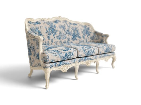 White carved sofa with blue toile upholstery